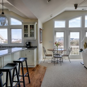 Sandmark custom remodel. Photograph of kitchen and living room