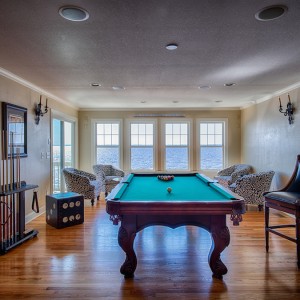 Sandmark custom remodel. Photograph of pool table in a recreational room