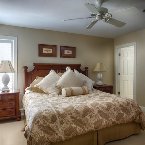 Sandmark custom remodel. Photograph of carpeted bedroom